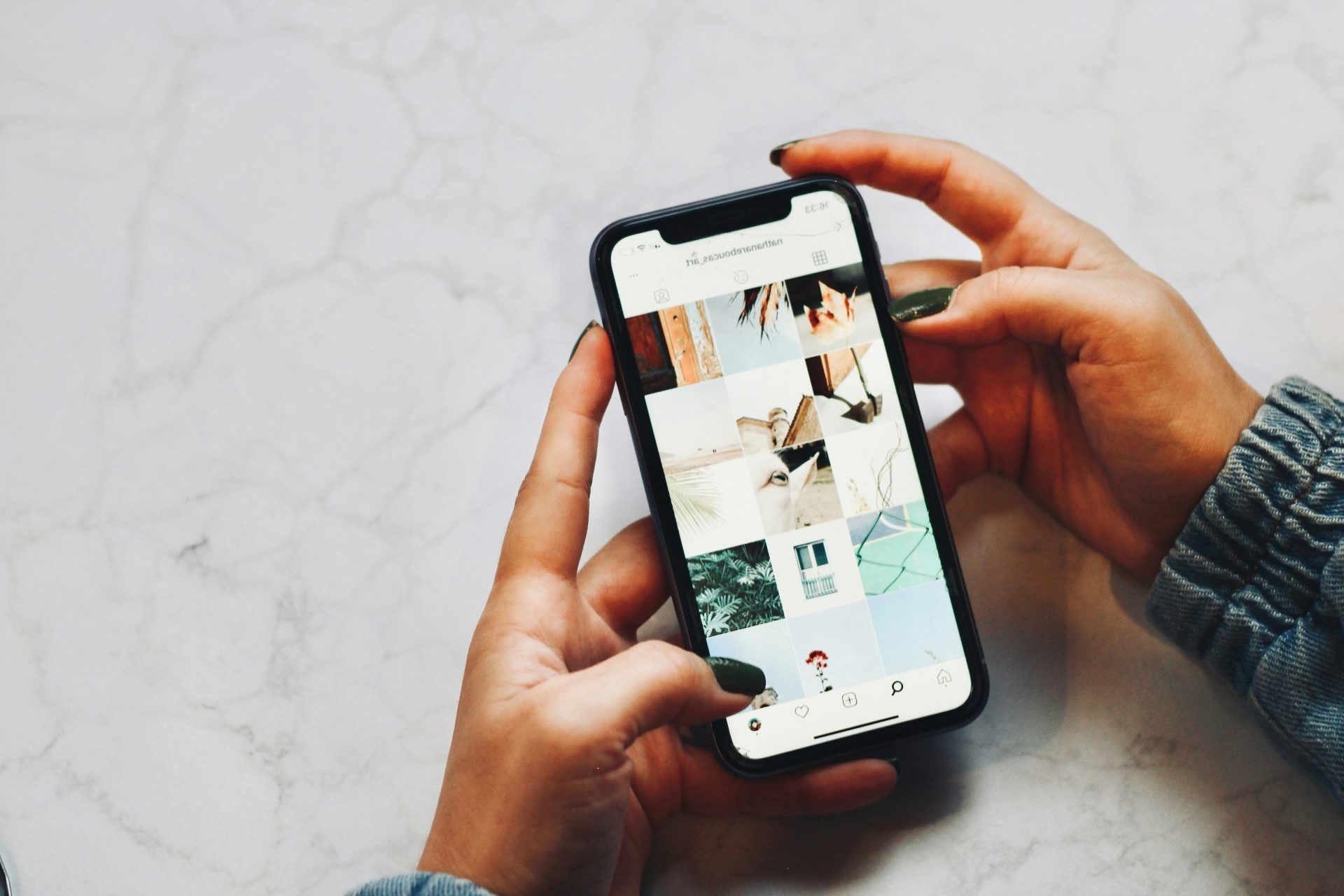 person holding white iphone 5 c
