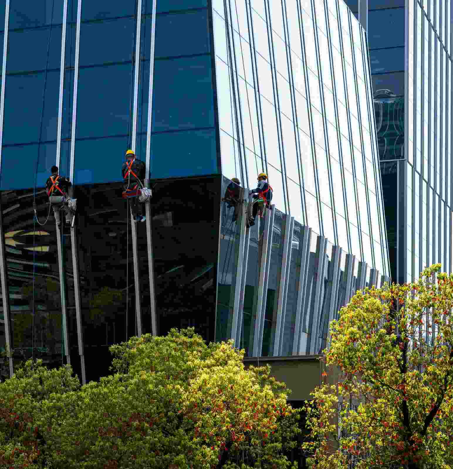 Window cleaners on skyscraper