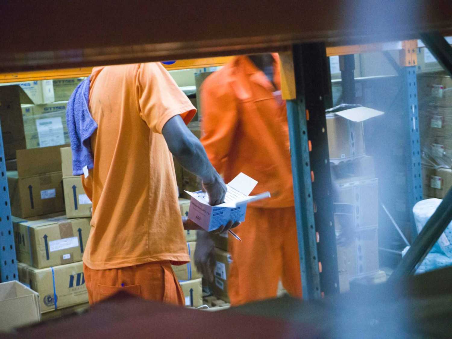 Warehouse workers handling packages