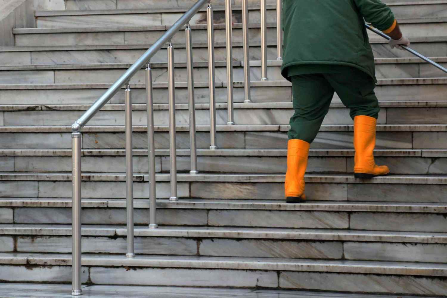 Person climbing marble steps