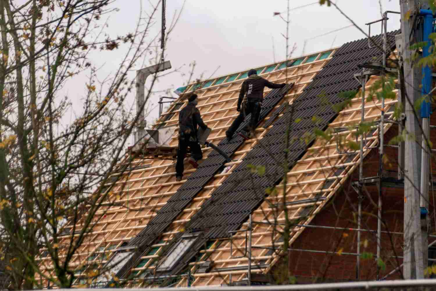 Roof installation with two workers
